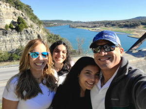 With my family in front of a body of water